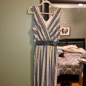 Striped jumpsuit with jewel accent belt detail